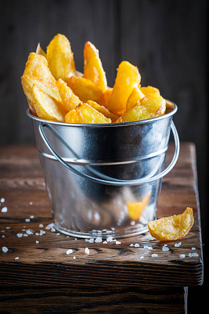 istock Yummy chips with salt made of fresh potato 623174834