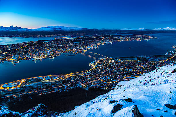 тромсо норвегия - mountain snow sunset house стоковые фото и изображения