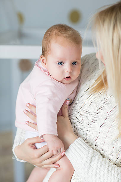 istock mother playing with her baby 623176692