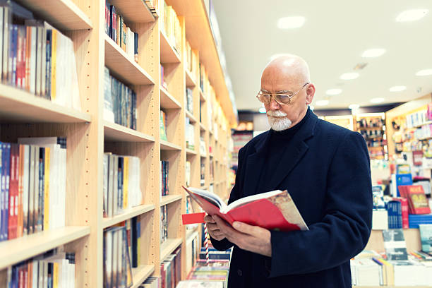 istock Senior man in bookstore 623181954