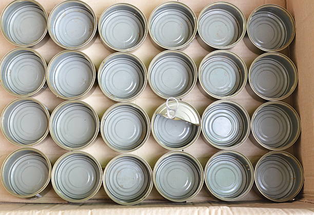 istock empty tin can food in brown paper box 623182432