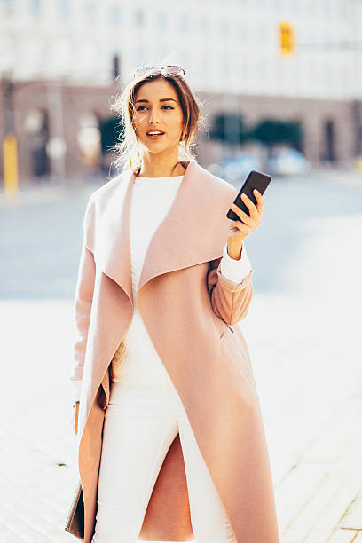 istock Beautiful woman texting on the phone 623185520