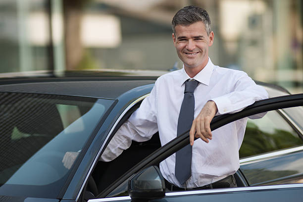 istock Businessman getting in his car 623188282
