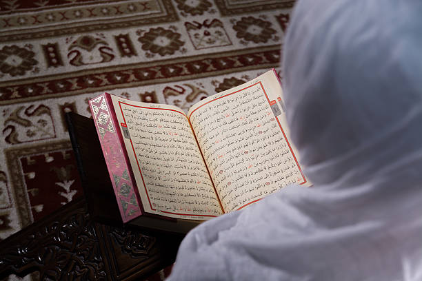 istock Muslim Woman Reading Koran in Mosque 623188878