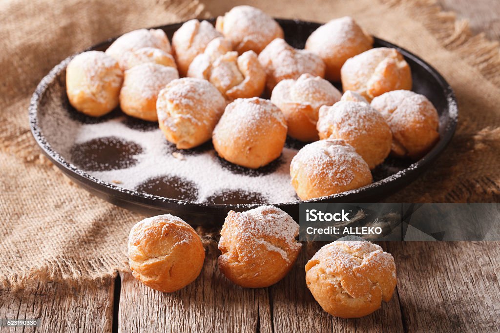 Italian sweetness Castagnole close-up on the table. Horizontal Italian sweetness Castagnole close-up on the table. horizontal, rustic Carnival - Celebration Event Stock Photo