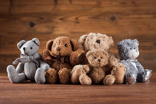 Cute teddy bears on wooden background