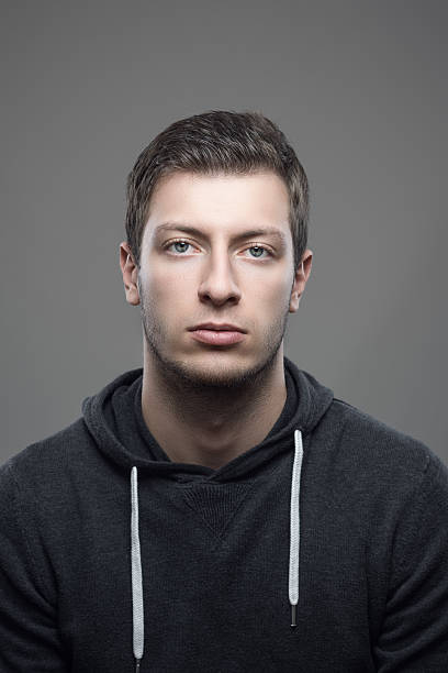 istock Vertical moody portrait of young casual man 623192302