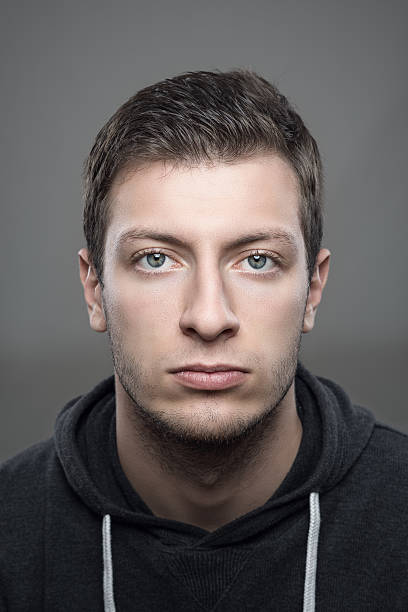 istock Vertical portrait of young casual man looking at camera 623192368