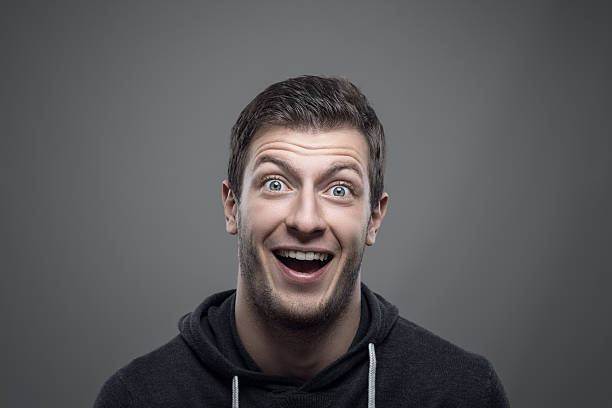 istock Moody portrait of surprised expressive young man looking at camera 623192436