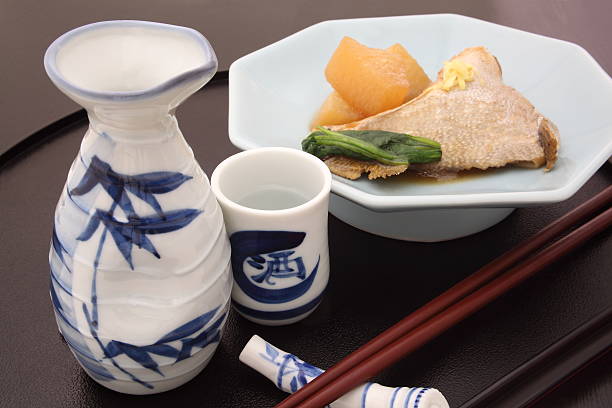 Japanese rice wine 'Sake' with simmered Japanese amberjack and white radish, 'Buri Daikon' traditional Japanese winter cuisine