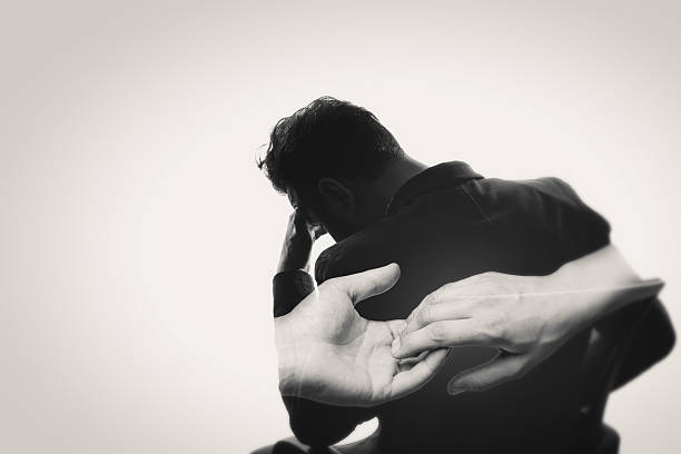 Concept, depicting parting. Black and white Concept, depicting parting. Black and white image created using multiple exposures. The photo silhouette upset man and a gesture symbolizing the parting. There is space for your text. sad gay stock pictures, royalty-free photos & images