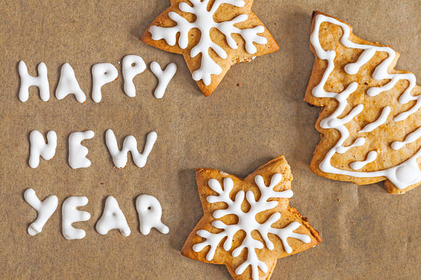 istock Christmas gingerbread cookies on a parchment inscription 623193678