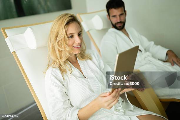 Couple Relaxing In Spa Center Stock Photo - Download Image Now - Adult, Alternative Therapy, Bathrobe