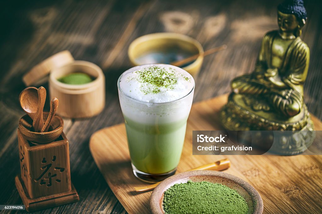 Matcha tea latte Still life with Japanese matcha accessories and matcha tea latte in glass Matcha Tea Stock Photo