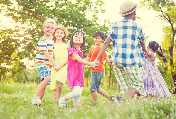 istock Children playing in the park Happiness Concept 623195328