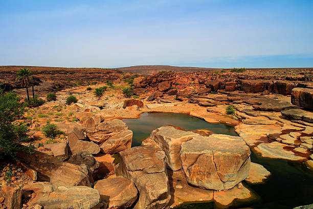 Panorama of rocky pond on Adrar plateau Mauritania stock photo