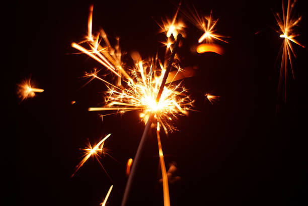 istock Sparkler on a black background, sparks fly in different directions, 623197982
