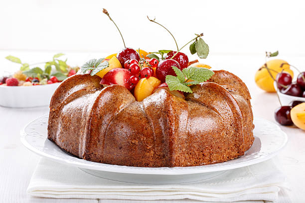 istock Naked cake derorated fresh fruit and berries 623198376