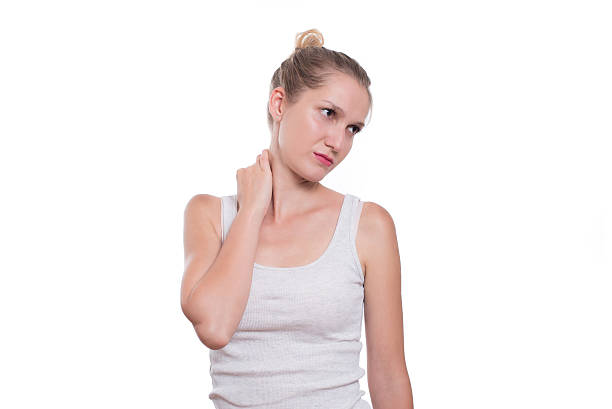 istock Woman with neck pain, isolated on white background 623199254