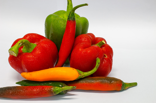 Red ,Green and Yellow peppers isolated on white background