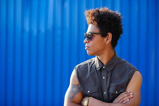 istock stylish african man looking to the side on blue background 623201474