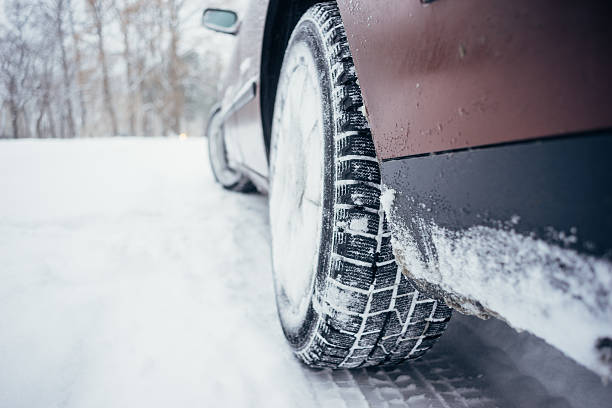 istock Car with winter tire on snowy road 623202696