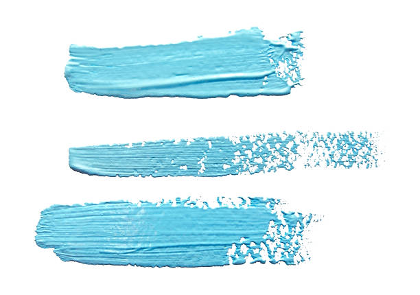 istock Three turquoise  light blue  strokes of the paint brush isolated 623203146