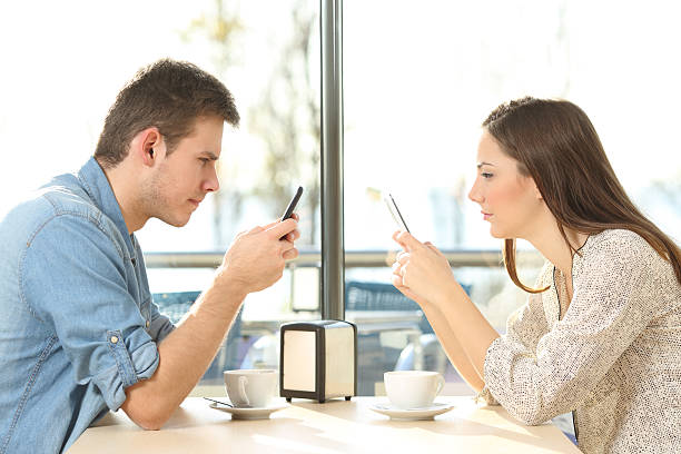 istock Couple on line obsessed with smart phones 623203712