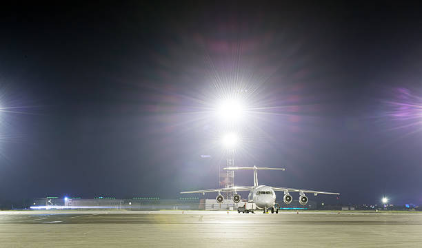 istock Passenger plane parked at the night airport. 623204354