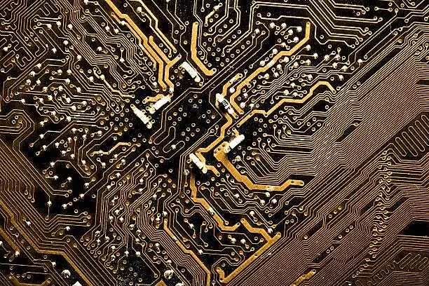 Photo of Close up of yellow computer circuit board