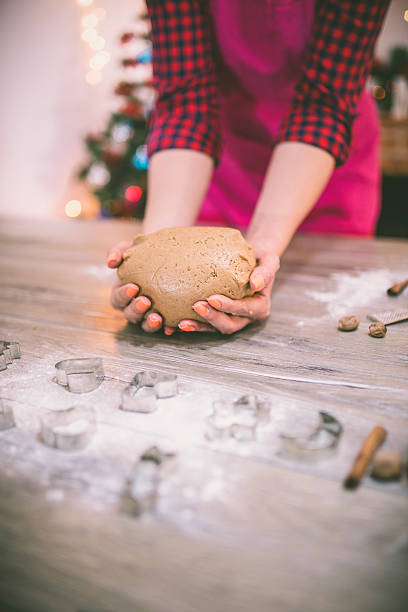 istock woman making gingerbread and cookies 623207810