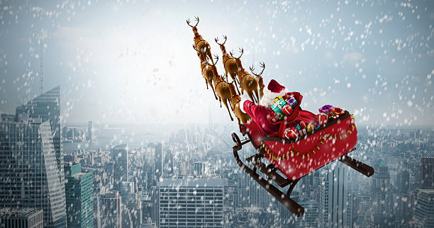 istock Santa Claus riding on sled with gift box against cityscape 623209112