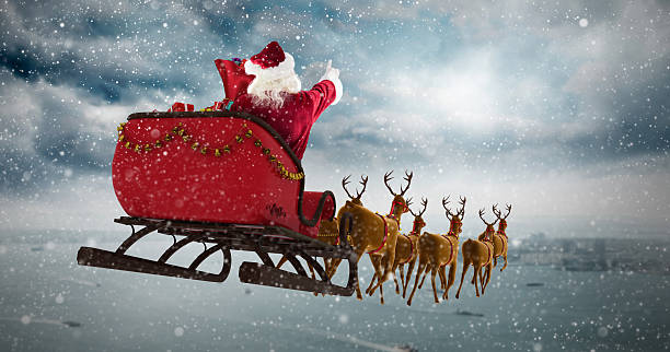 istock Santa Claus riding on sleigh during Christmas 623209142