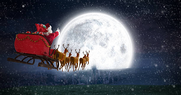 babbo natale in slitta contro la luna splendente - wireless technology three dimensional shape people men foto e immagini stock