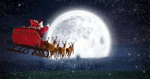 Santa Claus riding on sleigh against bright moon Santa Claus riding on sleigh with gift box against bright moon over city animal sleigh photos stock pictures, royalty-free photos & images