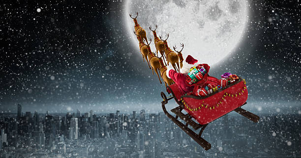 istock High angle view of Santa Claus riding on sled with 623209242