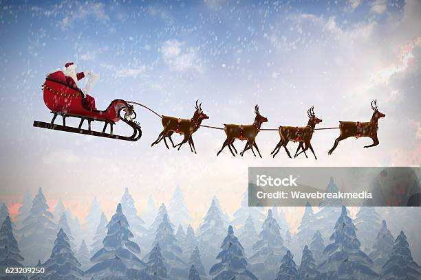 Side View Of Santa Claus Riding On Sleigh Stock Photo - Download Image Now - Animal Sleigh, Santa Claus, Sled