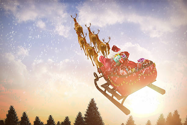 istock Santa Claus riding on sled with gift box 623209298