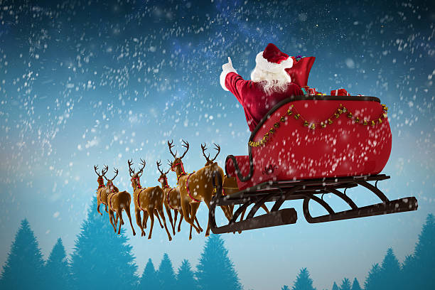 istock Santa Claus riding on sleigh during Christmas 623209302