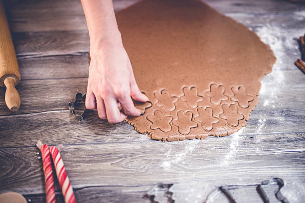 istock woman making gingerbread and cookies 623209306