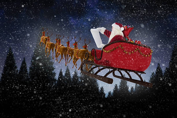 istock Santa Claus riding on sled during Christmas 623209390