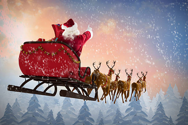 istock Santa Claus riding on sleigh during Christmas 623209482