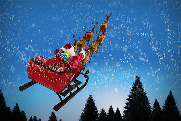 istock High angle view of Santa Claus riding on sled 623209490
