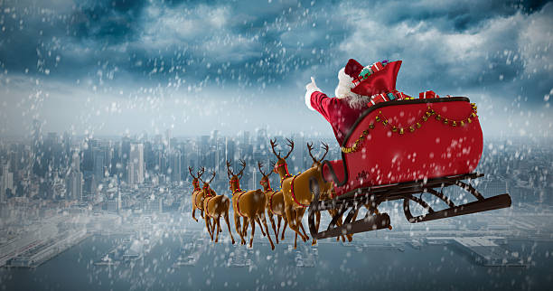 istock Santa Claus riding on sleigh with gift box against coastline 623209498