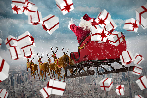 istock White and red christmas presents against gloomy city 623209512