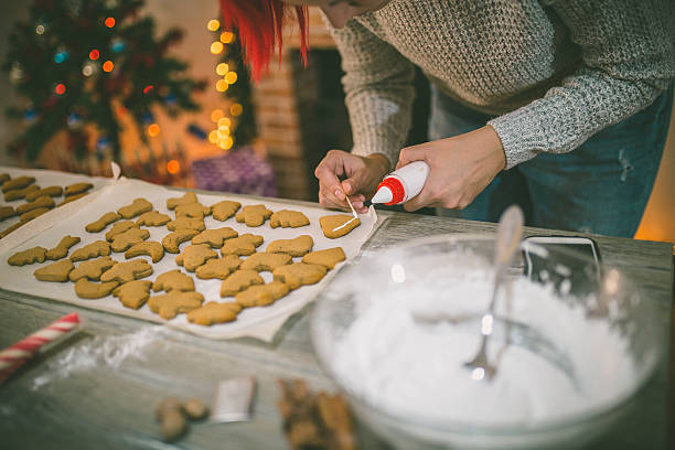 istock woman making gingerbread and cookies 623209960