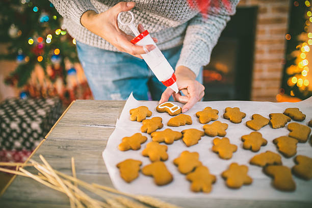 istock woman making gingerbread and cookies 623210086