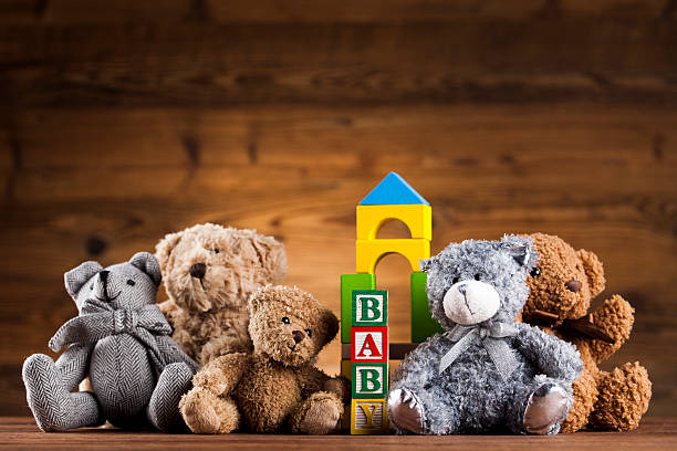 istock Cute teddy bears on wooden background 623211706