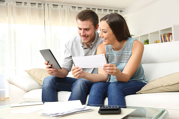 istock Happy couple checking bank account online 623211758