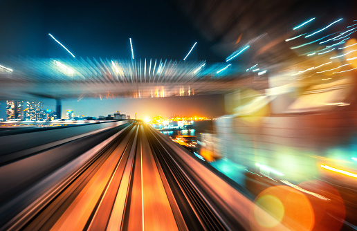 abstract motion-blurred view from the front of a train in Tokio, Japan